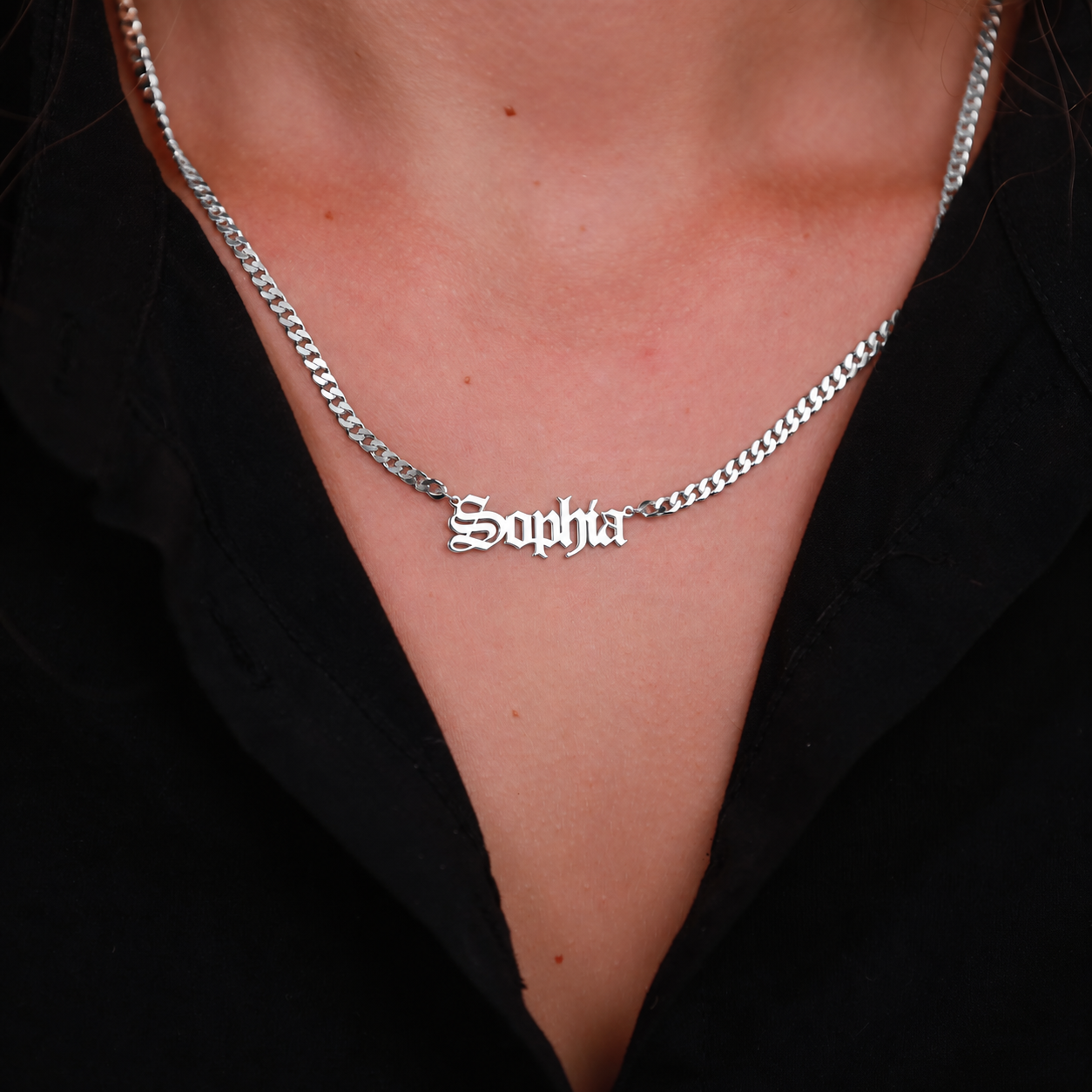 Sophia Old English nameplate necklace in 925 sterling silver with a curb chain, worn on the neck